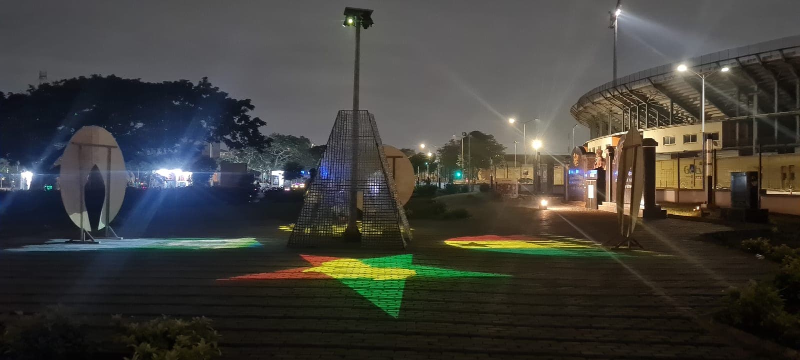 Colour projected across the ground around the tower